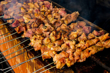 sate klatak or sate kambing or satay goat, lamb, Lamb or meat goat satay with charcoal ingredient on red fire grilling by people, Indonesia cooking satay. with selective focus
