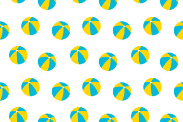 Seamless pattern of blue and yellow beach balls on a clean white background, perfect for fun summer projects.