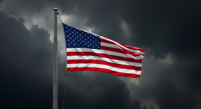 American flag flying proudly against a dramatic cloudy sky symbolizing strength and unity