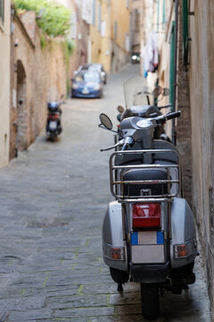 Fototapeta Close-up of the Rear End of a Motorcycle Parked on the Streets of Siena, Tuscany, Italy