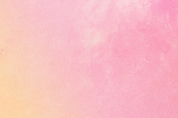 Light pink and peach pastel paper texture with subtle grain and faded imperfections, ideal for backgrounds, crafts, or design projects.