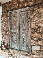 Vintage wooden door in stone wall
