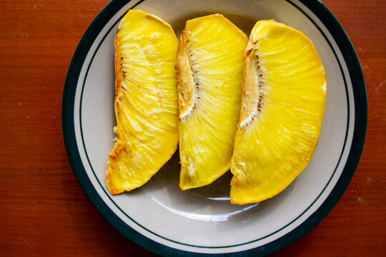 sukun goreng or fried breadfruit served at plate on black background