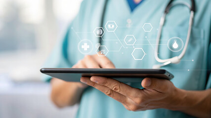 Healthcare professional in scrubs uses tablet with medical icons floating above, symbolizing digital health