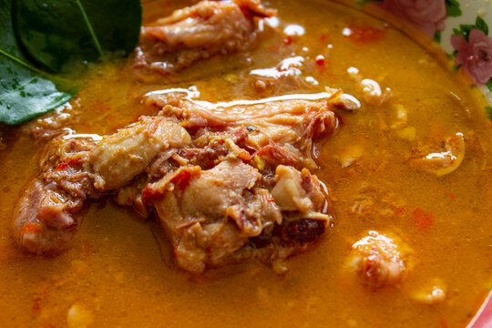 chicken curry or kari ayam served on bowl, isolated on white background