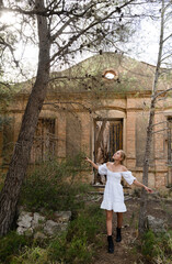 Woman walking next to the abandoned house