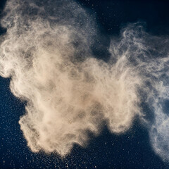 White dust on dark blue background