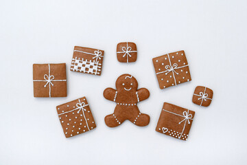 Decorated gingerbread cookies - christmas presents and gingerbread man on a white background