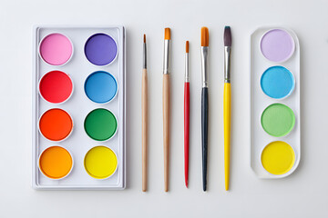 Naklejka premium Watercolor Paints and Brushes Still Life, isolated on white background