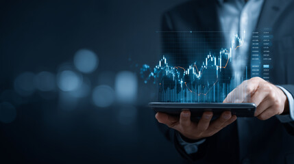 Businessman holding digital tablet with financial graphs and stock data overlay, concept of investment, fintech, and market analysis financial technology, stock market, investment