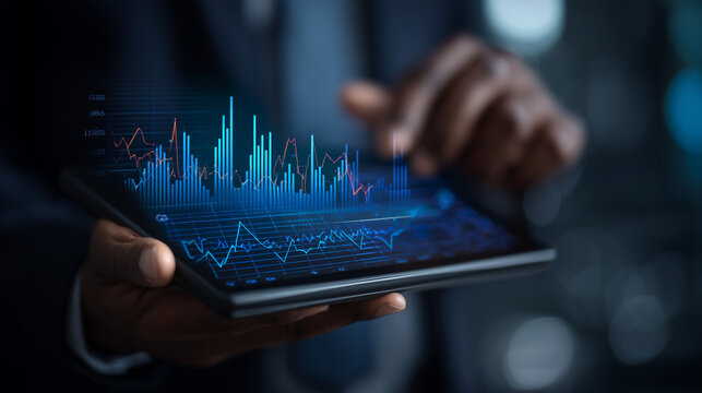 Businessman holding digital tablet with financial graphs and stock data overlay, concept of investment, fintech, and market analysis financial technology, stock market, investment