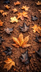 Fallen black autumn leaves scattered on the dry brown ground with some of them being crushed and others still intact