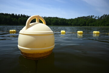 Buoys, warning floats at the bathing area. Safe recreation by the water.