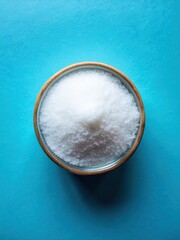 Close-up of erythritol inscription on a sweetener with a blue background top view