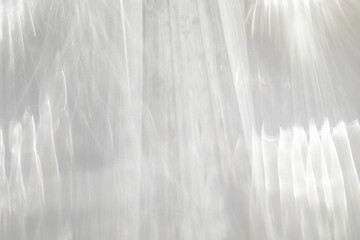 Abstract sunlight shadows background with flare and glare top view. Natural abstarct aesthetic mockup with caustic effects for design and presentation.