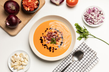 Top view of cold tomato soup, salmorejo, served with iberico jam.