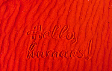 Bright red Martian sand with the inscription 