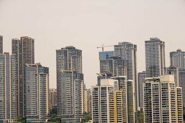 Fototapeta premium modern apartment building with balconies and laundry drying in Chongqing, China