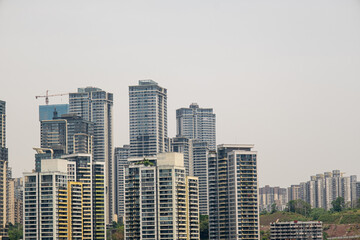 Fototapeta premium modern apartment building with balconies and laundry drying in Chongqing, China