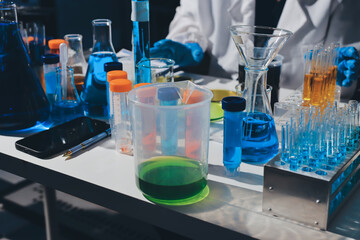 Scientist pipetting medical samples into microplate in laboratory