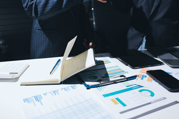 Two business people analyzing the data