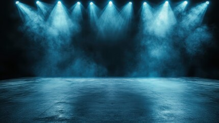 This image showcases a dramatic stage lit by blue lights, enveloped in a misty atmosphere, ideal for showcasing performances and creating an ambiance of anticipation.