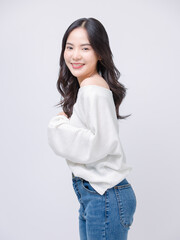 Half body portrait happy smile young asian beautiful woman curly hair wearing long sleeve shirt, blue jeans outfit, casual standing pose on white background joy positivity fashion lifestyle concept.