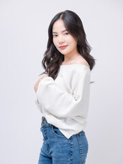 Half body portrait happy smile young asian beautiful woman curly hair wearing long sleeve shirt, blue jeans outfit, casual standing pose on white background joy positivity fashion lifestyle concept.