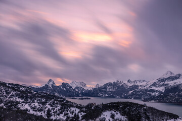 Sunset in the storm. The colors of the sunset emerge from between the clouds in the midst of one of the few snowfalls of winter.