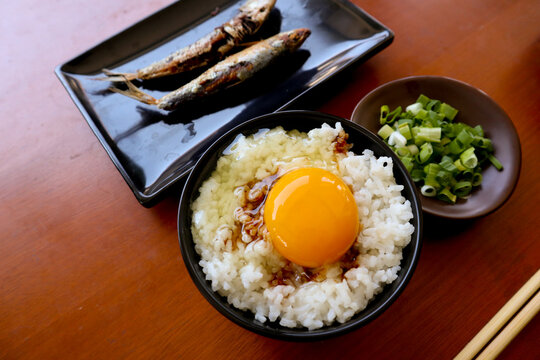 "tamago kake gohan or raw egg on rice. traditional food from japan, eat on breakfast"