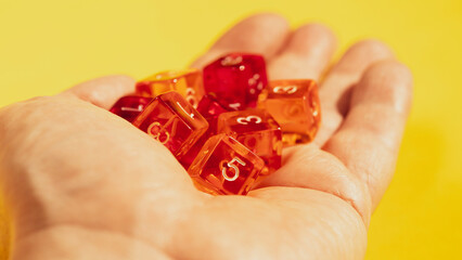 Gambling concept. Close-up of a hand with dice.