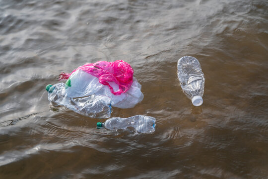 Plastic trash floats in the ocean, highlighting the urgent issue of marine - Powered by Adobe