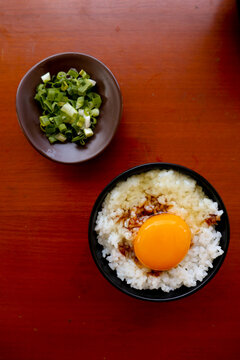 "tamago kake gohan or raw egg on rice. traditional food from japan, eat on breakfast"