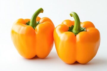 Two vibrant orange bell peppers (1)