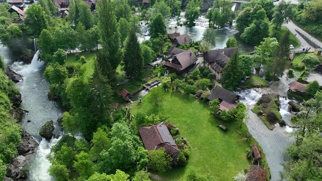 Watermill village Rastoke on rivers Slunj and Korana. Charming village of Rastoke with waterfalls, wooden houses, rivers running through. Aerial view of fairy-tale spring location in heart of Croatia