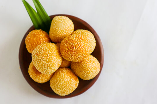 "onde-onde or sesame ball or Jian Dui is fried Chinese pastry made from glutinous rice flour and coated with sesame seeds filled with bean paste. isolated on white background"