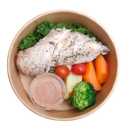 A healthy meal bowl with sliced seasoned chicken breast, cherry tomatoes, carrot sticks, broccoli,...