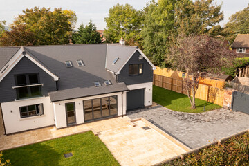 Modern Detached House with Garden and Driveway – Aerial View of Contemporary Suburban Home in...