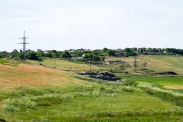 A field with a tower in the distance