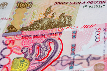 100 Russian ruble and 5000 Kazakhstani tenge banknotes. International trade concept