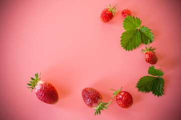 Bright juicy strawberries on a minimalist background