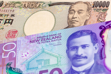 10000 Japanese yen and 50 New Zealand dollar banknotes. International trade concept