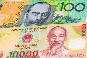 100 Australian dollar and 10000 Vietnamese dong banknotes. International trade concept