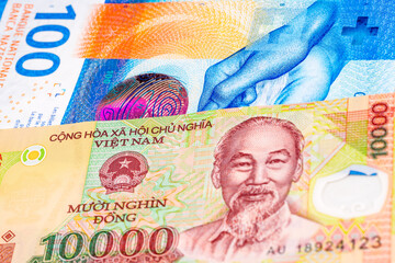 100 Swiss frank and 10000 Vietnamese dong banknotes. International trade concept