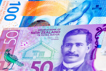 100 Swiss frank and 50 New Zealand dollar banknotes. International trade concept