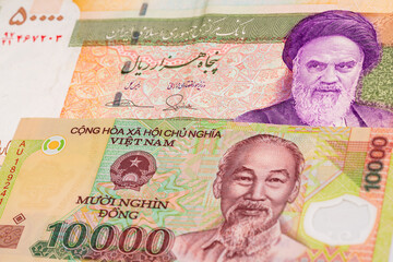 50000 Iranian rial and 10000 Vietnamese dong banknotes. International trade concept