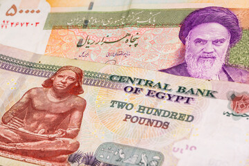 50000 Iranian rial and 200 Egyptian pound banknotes. International trade concept