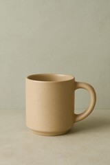Obraz premium A neutral ceramic mug on a light background, perfect for holding your favorite warm beverage