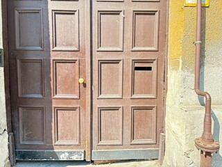 A crumbling inner city building gate.