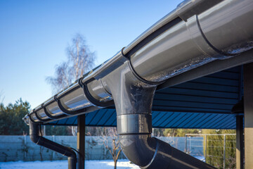 Plastic gutter and drainage system for water from melted snow and rain.
